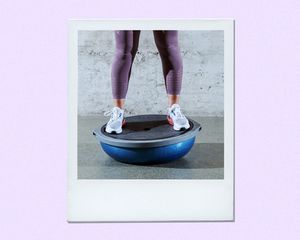 Woman balancing on a Bosu ball.