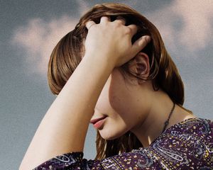 woman scratching scalp