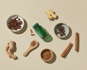 Composed image of scattered ginger, cinnamon sticks, supplements, ashwagandha, etc.