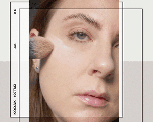Woman Applying Foundation with a Makeup Brush Using the 'Bake' Method