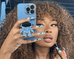 Megan Thee Stallion applying lipstick