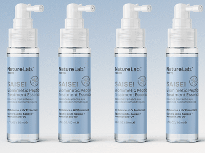 Naturelab Tokyo Saisei Hair Essence on a blue background